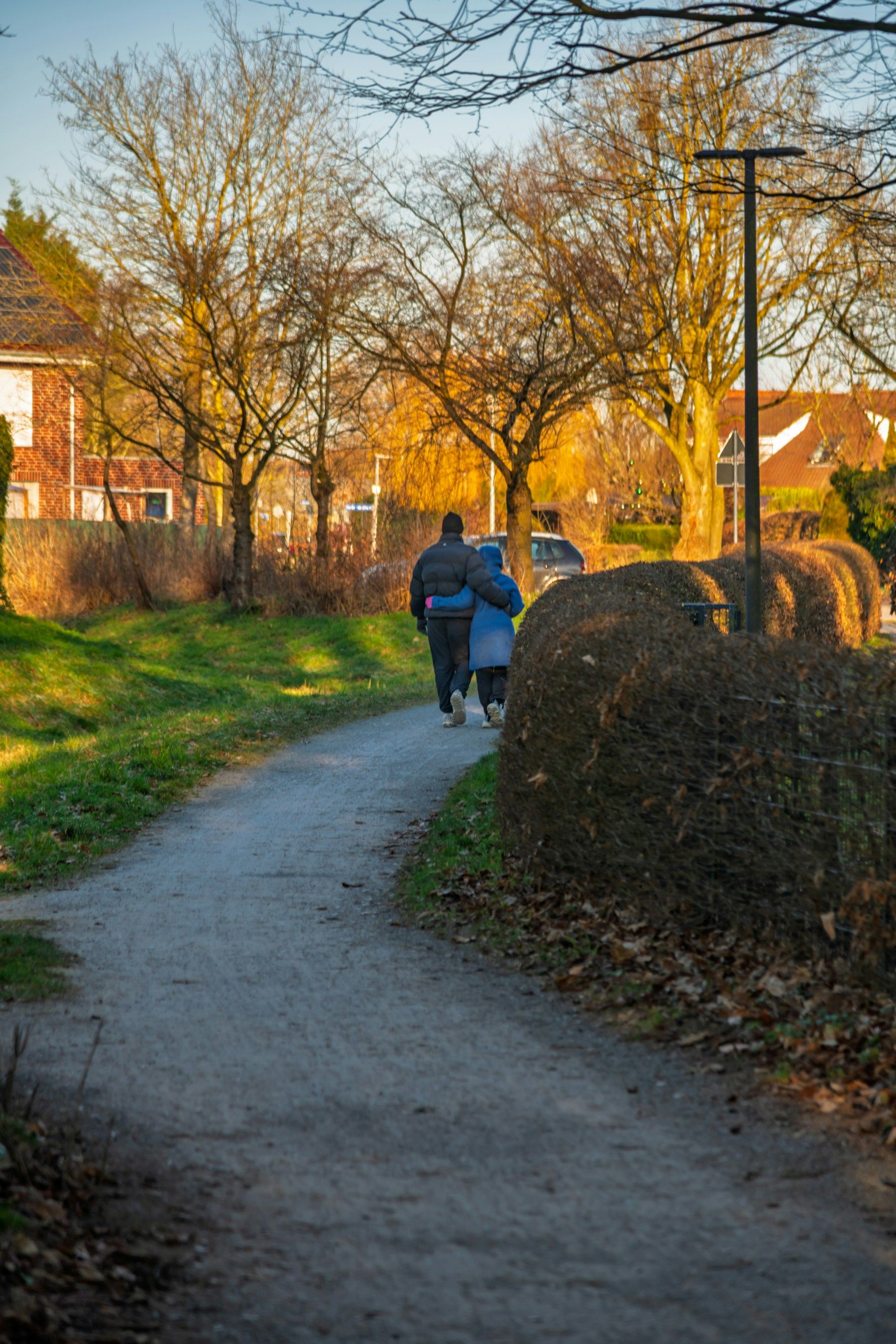 A couple walking together through an open landscape